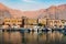 Khasab, Oman - October 5, 2018: Khasab city creek and desert rock scenery with houses at sunset