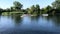 KHERSON - AUG, 28, 2019: Close up of group of four young adults having fun riding canoe on beautiful river