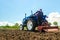 Kherson oblast, Ukraine - May 28, 2020: Farmer loosens and cultivates soil of field. Milling soil, crushing before cutting rows