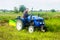 Kherson oblast, Ukraine - September 19, 2020: A farmer on a tractor digging out potato. Farming and farmland. Food production