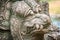 Khmer` s style Naga head made from sand stone at the public temple in Thailand. Naga or large snake according to Hindu belief.