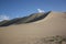 Khongor sand dunes with the vegetation in the foreground, Umnugovi region, Mongolia.