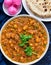 Khoya makhana matar curry with roti and pickled onions