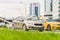 Kia Cee`d Second generation JD accelerating in highway on urban background. Beige hatchback car fast speed drive on city road