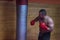 Kick boxer training on a punching bag