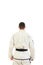 Kickbox fighter wearing kimono with black belt in back view