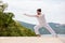 Kickboxer or muay thai fighter Man in white training karate Wushu on mountain