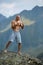 Kickboxer or muay thai fighter training on a mountain cliff
