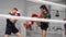 Kickboxers training roundhouse kick on ringside in sparring in fight club.