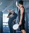 Kickboxing, combat and fighter woman training high kicks with her coach in the gym. Female athlete performing martial