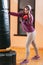 Kicking punching bag kickboxing female athlete