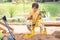 Kid baby boy todler playing construction truck toy diging sand in playground