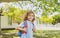 Kid with backpack going to school. Kids education concept. Child with rucksacks standing in the park near school. Pupils