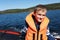 Kid on boat in Ladoga skerries