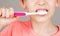 Kid boy brushing teeth. Boy toothbrush white toothpaste. Health care, dental hygiene. Joyful child shows toothbrushes