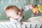 Kid boy infant standing in his bed