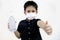 Kid boy in a mask thumbs up,hold a bottle of alcohol antiseptic gel for disinfection,equipment for cleaning hands during pandemic