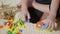 Kid boy preschool playing creative plastic toy blocks