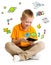 Kid boy sitting with tablet computer and learning or playing