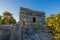 Kid climbing on the top of antique ruins