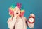 Kid colorful curly wig clown style hold alarm clock. I am not joking about discipline. False alarm. Girl worry about