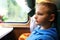 Kid in compartment of retro train carriage