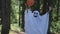 kid in a costume ghost with orange balloon. Halloween celebration holiday. Funny smiling grimace