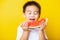 Kid cute little boy attractive laugh smile playing holds cut watermelon fresh for eating