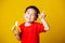 Kid cute little boy attractive smile wearing red t-shirt playing holds peeled banana for eating