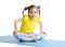 Kid does gymnastics sitting in butterfly pose