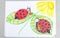 Kid drawing of two cute ladybugs sitting on green leaves of flower