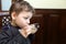 Kid drinking tea