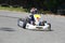 Kid driving competition kart on training