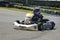 Kid driving competition kart on training