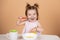 Kid eat healthy nutrition, baby food. Babies eating with spoon. Little baby eating puree.