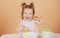 Kid eat healthy nutrition, baby food. Babies eating with spoon. Little baby eating puree.