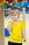 Kid eating lolly pop on the playground