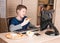Kid eating pizza and surfing on internet or watshing funny video
