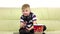 Kid eats popcorn and plays joystick online game, slow motion