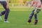 Kid enjoy to playing with little ball on field