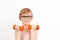 Kid exercising with dumbbells in health sporty club. Healthy childhood. Boy raising a dumbbell