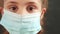 kid face in medical mask. covid coronavirus pandemic medicine concept. portrait of a face girl covid kid child in a