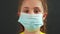 kid face in medical mask. covid coronavirus pandemic medicine concept. portrait of a face girl kid child in a protective