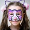 Kid with face painting of kitty, cute little girl with painted mask