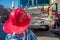 Kid with a fire fighter helmet in front of a fire truck