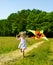 Kid flying kite outdoor.