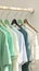 Kid friendly pastels Shirts hanging on rack, soft and inviting