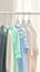 Kid friendly pastels Shirts hanging on rack, soft and inviting