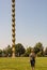 Kid in front of The Endless Column Column of Infinite or Coloana Infinitului. Impressinve landmark part of Unesco World Heritage