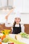 Kid girl chef on countertop funny gesture with roller knead